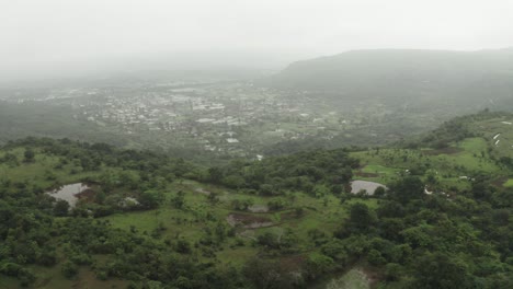 the drone camera is moving forward where there are mountains in the middle of the fog