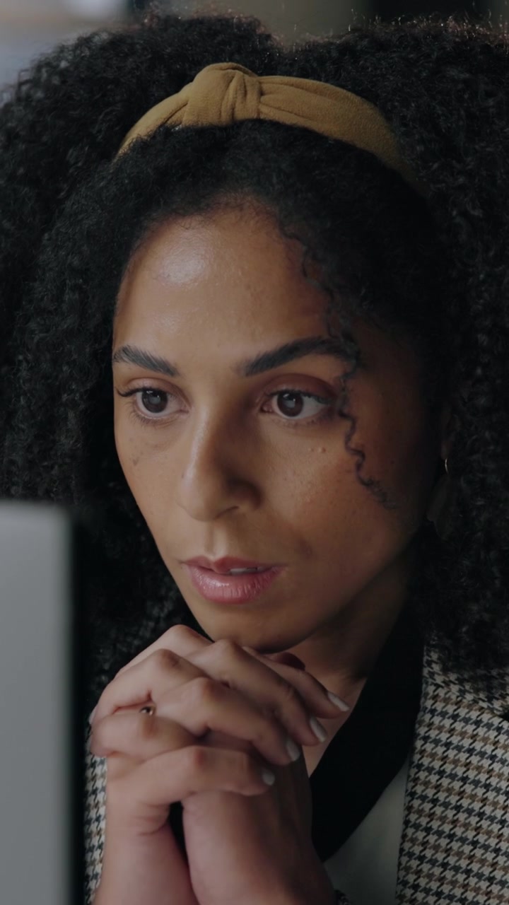 Focused Professional Woman Contemplating at Her Desk