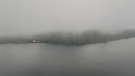 Foggy-Clouds-Revealed-Green-Lush-Mountains-Over-West-Coast,-Norway