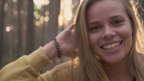 the face portrait of happy girl in sunny forest