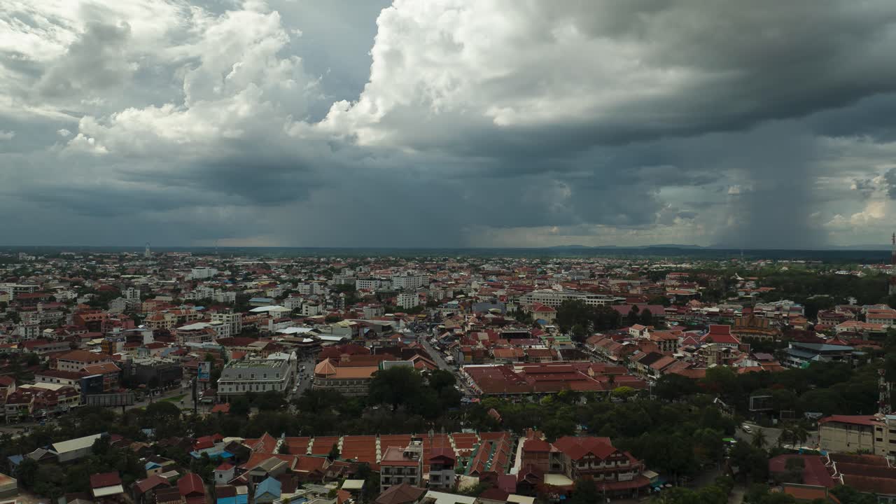 Storm brews above Siem Reap cityscape in cinematic aerial timelapse