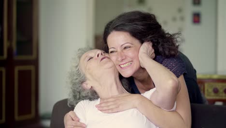 Daughter-coming-to-mother,-they-greeting,-hugging-and-kissing