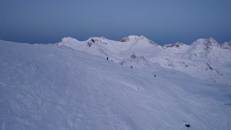 skiers on the way to the top in the arctic