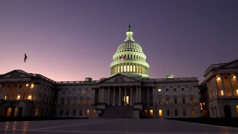 the illuminated us capitol building at dusk