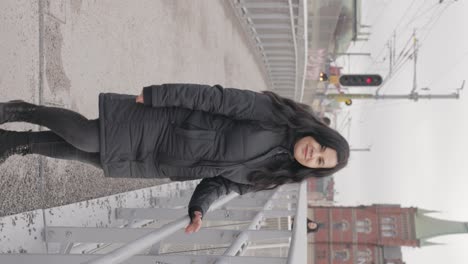 Vertical-View-Of-A-Woman-Strolling-Around-The-Urban-Area-Of-Stockholm,-Sweden