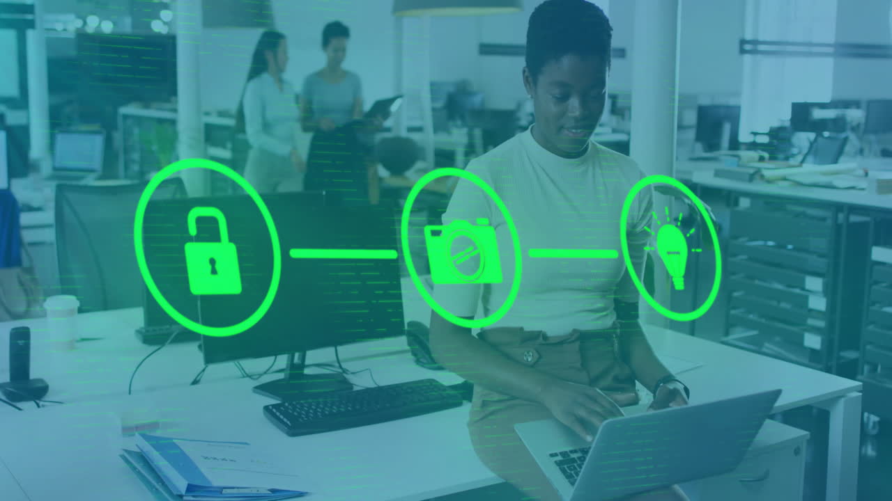 Animation of network of connections with icons over african american businesswoman in office