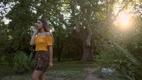 young girl model walking and putting flower in hair