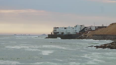 Oceanside-Home,-Islands-And-Waves-El-Silencio-Beach,-Punta-Hermosa,-Peru-4k