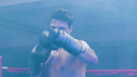 joven atractivo haciendo lucha de sombras hacia la cámara