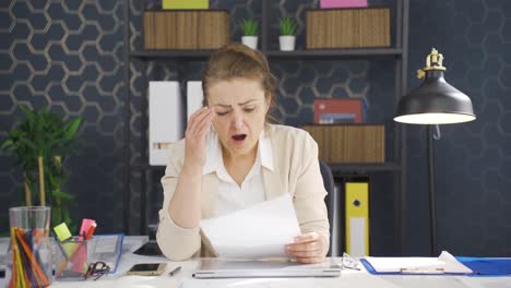 business woman upset with negative paperwork results.