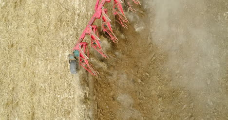 Aerial-View-Of-Harrows-Plowing-Field-