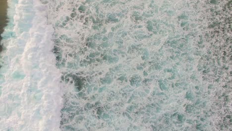 waves crashing over reef