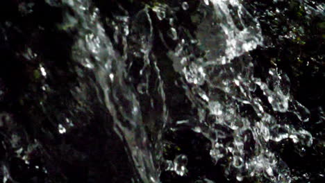 extreme closeup of water as it falls from a waterfall in the mountains of nc shot at 180 frames per second