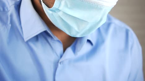 man wearing a blue face mask