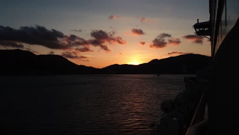 view of sunset over a mountain from a cruise ship