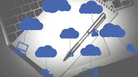 animación de nubes e iconos digitales sobre el cuaderno y el bolígrafo en el escritorio
