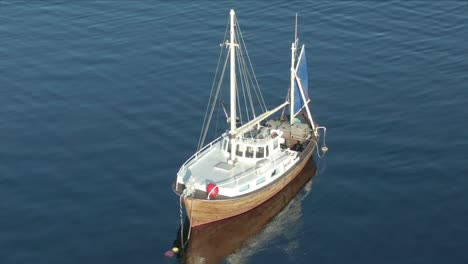 a sailboat moored in the fjord near the steinvikholm castle, norway