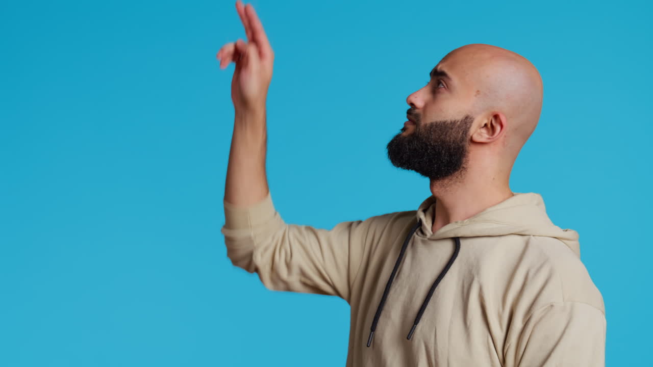 Arab man exploring artificial intelligence with holograms