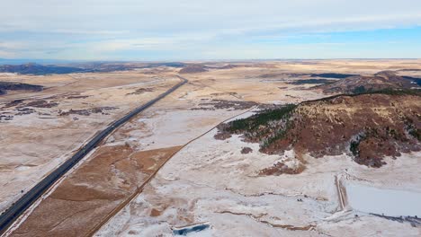 airplane flight along i-25 near the town of monument, colorado during the winter