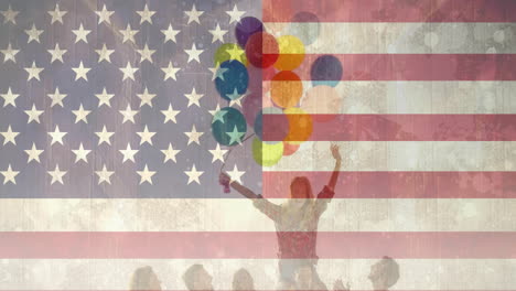 animation of flag of usa over diverse friends holding balloons