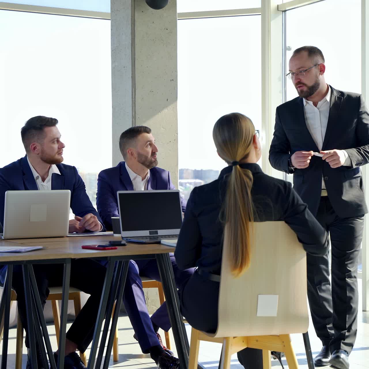 Modern office meeting with businessmen. Team courses in office