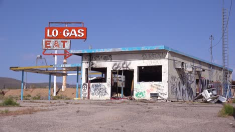 a spooky old abandoned gas station and restaurant in ruins in the mojave desert 3