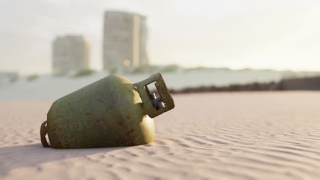 old rusted metal gas tank on the beach