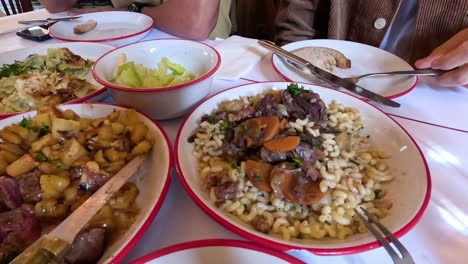 people sharing a meal with various dishes