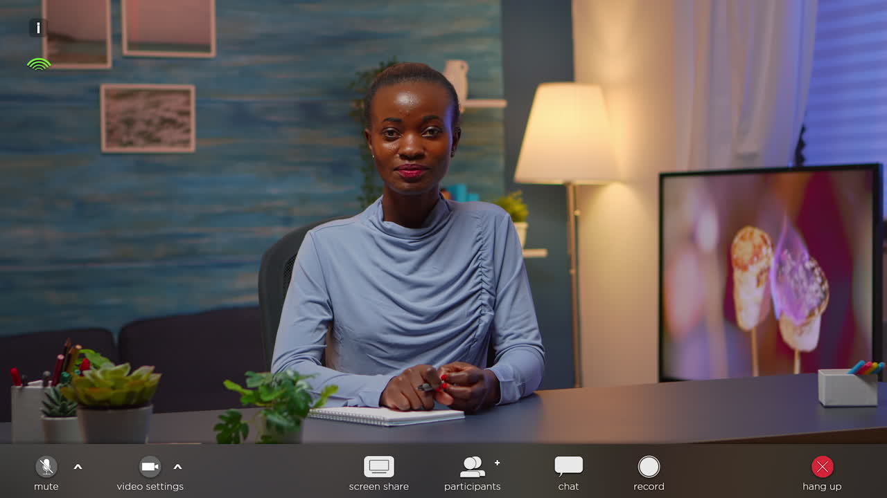 African freelancer working from home talking on camera