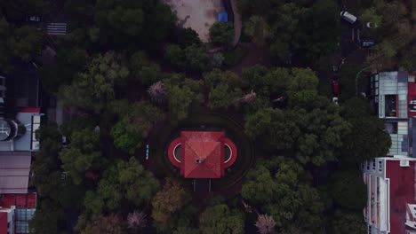 bird's eye view of lincoln park, with its red-roofed clock tower, ponds, playgrounds and music hall nestled among several trees