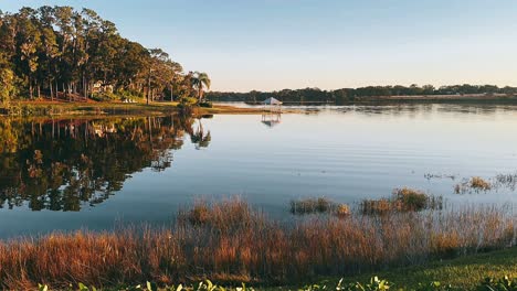 tranquil lakeside pavilion at sunrise/sunset