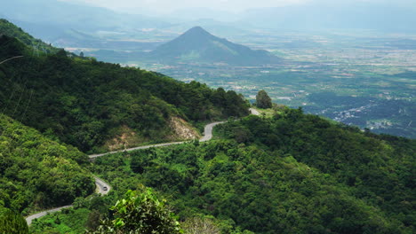 bus traveling on the mountain forest road in the country side