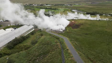 Majestic Icelandic mountainside unfolds in 4K, where verdant slopes meet mysterious smoke, creating a compelling visual of nature&#039;s raw juxtaposition