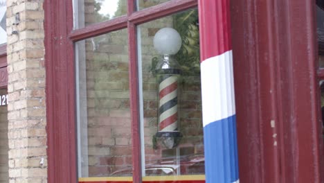 barber pole in lansing, michigan old town district with stable establishing shot