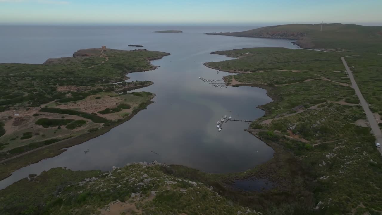 Aerial above Colom Island Menorca Spain Sanisera natural port harbour