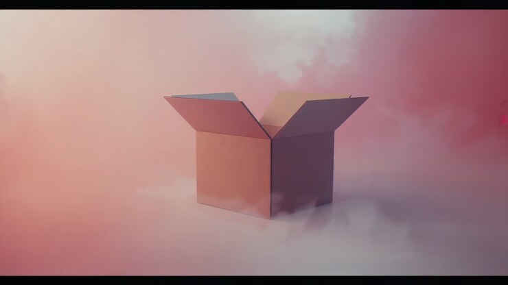 Fog starting around open four-flap cardboard box on cloudbank, lighting deepening, letterbox bars
