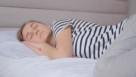 woman sleeping peacefully in bed