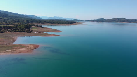 Lake Plastiras Drone Footage Near Shore on Sunny Summer Day in Greece