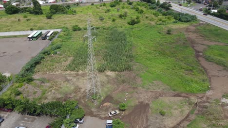 high voltage transmission electric power tower located in a rural area