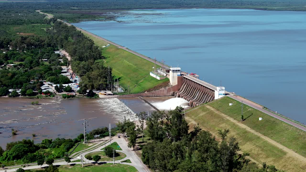 The Frontal Dam of Rio Hondo with its floodgates open, releasing water in a powerful display
