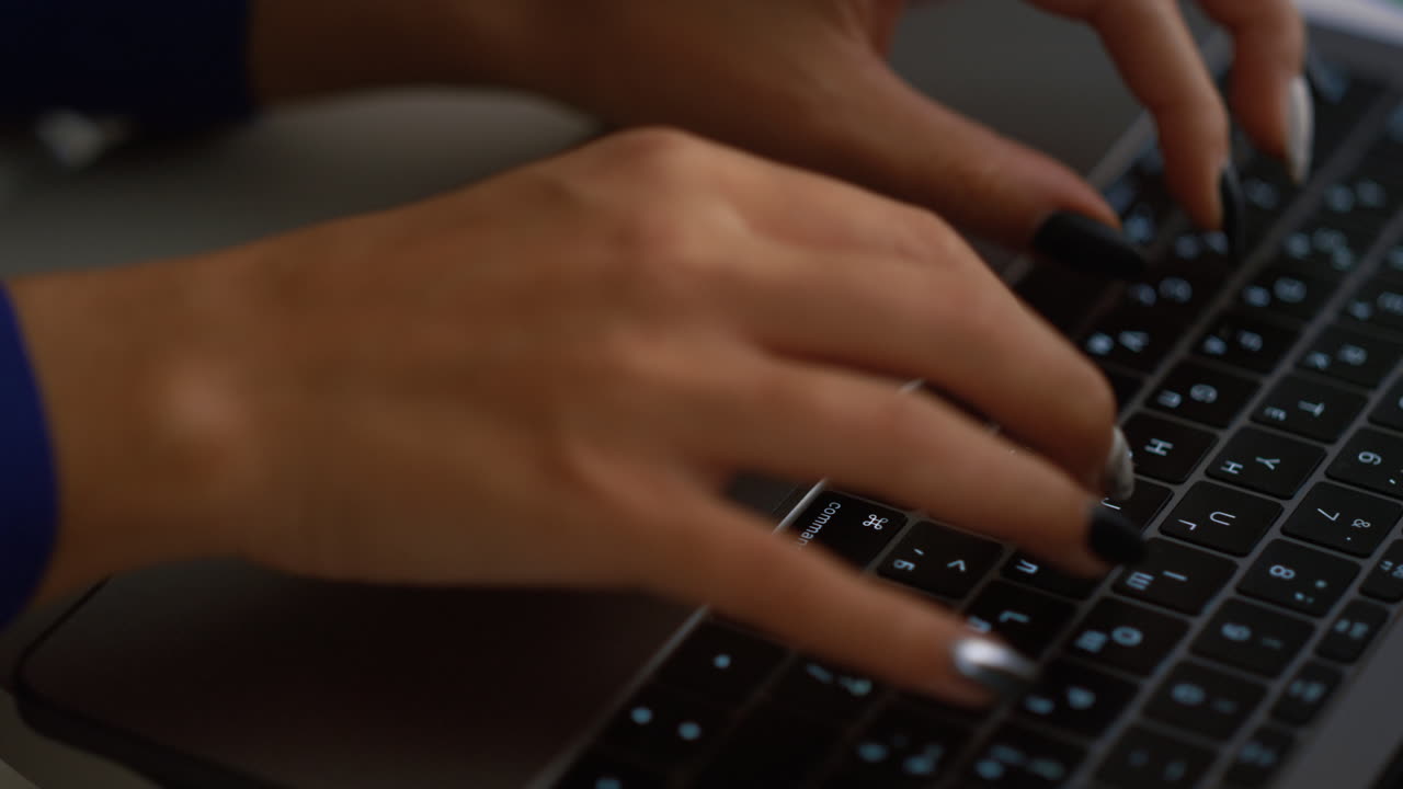 African american woman hand typing laptop computer keyboard in business office.