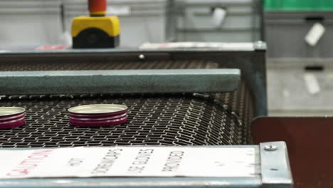 aluminum caps on the conveyor belt system at the factory