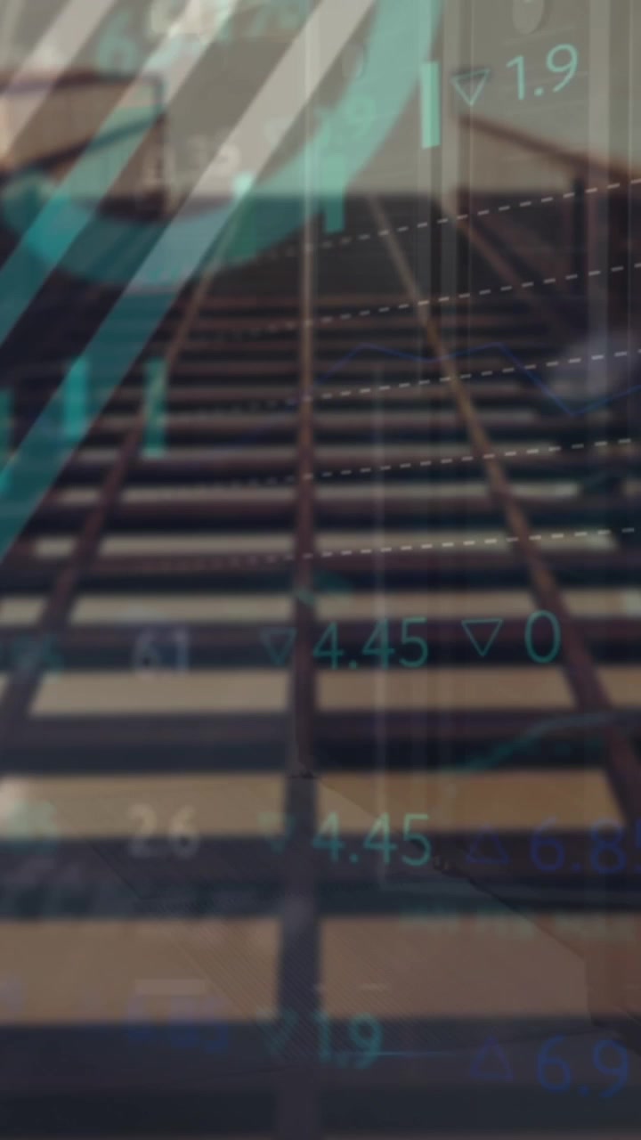 Animation of graphs, trading board and globe over low angle view of modern building against sky
