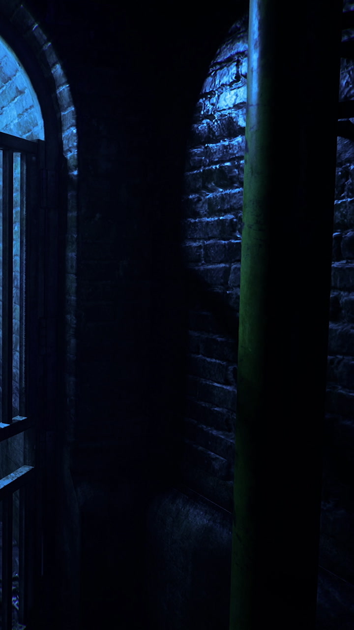 Light shines through a barred window in a dark room with old bricks and shadows