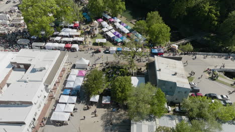 siloam springs with booths and stalls during dogwood festival in ar, usa - drone shot