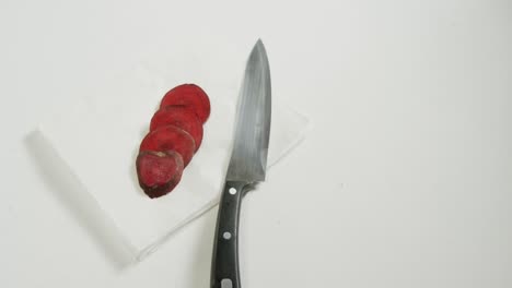 sliced beetroots and knife on white background 4k 4k