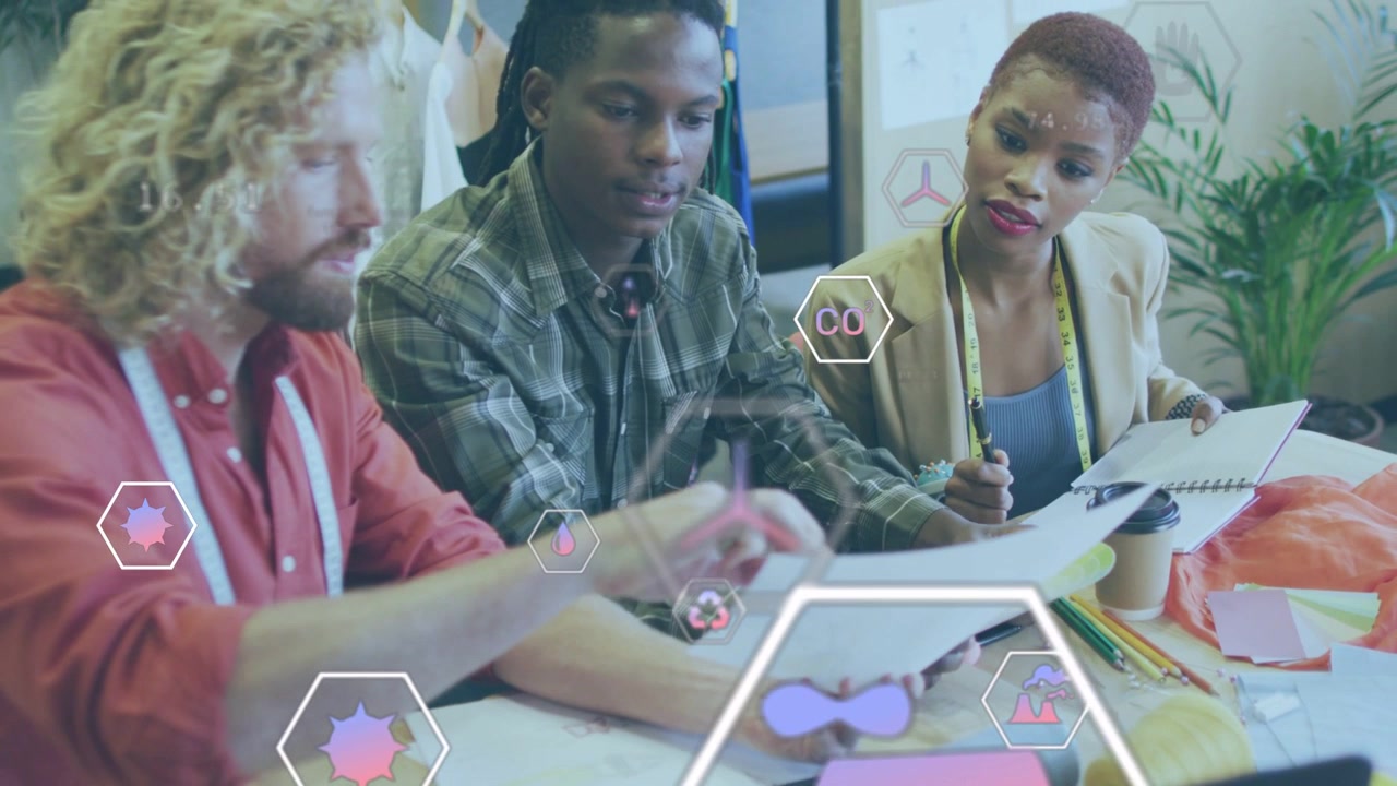 Left designer showing papers in design studio, AR hex marking charts while team noting feedback