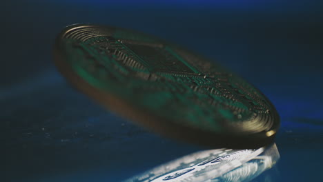 coin in motion on a dark surface