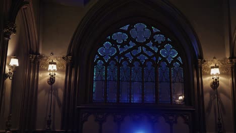 stained glass window in a dark gothic interior