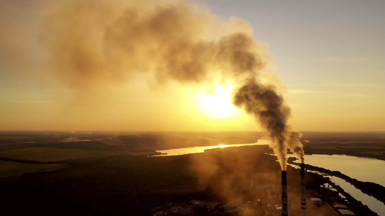 Thick smoke of factory chimneys. Smoke and steam from high chimney of power plant